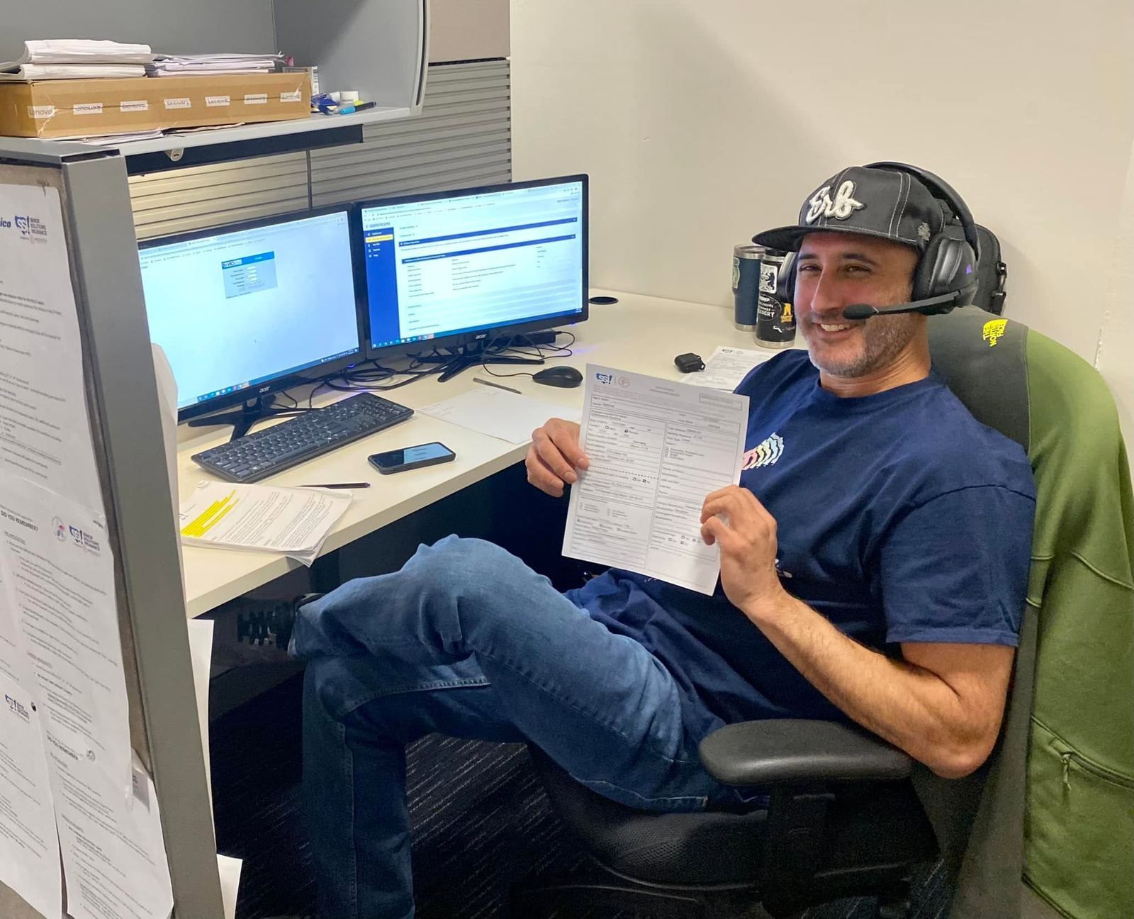 A Senior Solutions agent at his desk working through a client's coverage amount